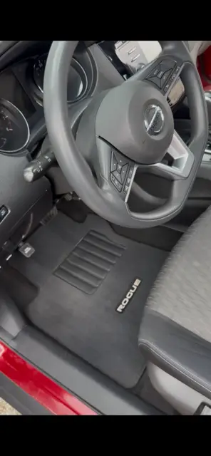 The same Nissan Rogue footwell with the mat cleaned and the console and vents wiped down
